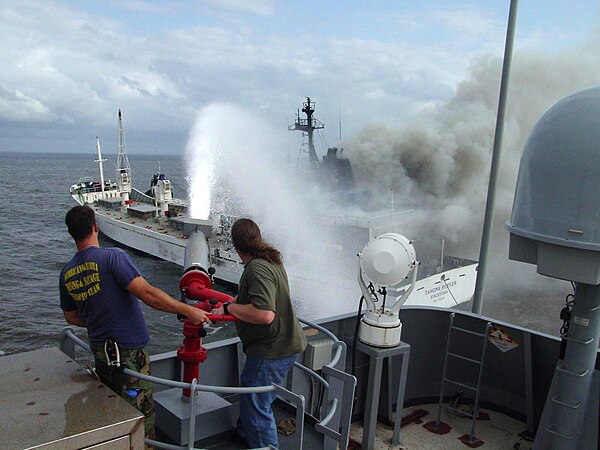 USNS Apache fighting fire aboard Tahoma Reefer