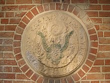 The defaced Great Seal of the United States in 2004. The Iconoclasm shown is a form of propaganda US Embassy Tehran.JPG