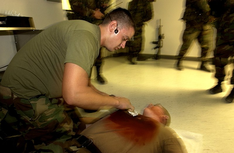 File:US Navy 031212-N-9964S-019 Hospital Corpsman 3rd Class John Williams, treats Pfc. Glenn Vanhoesen, for a simulated sucking chest wound during a mass casualty training exercise.jpg