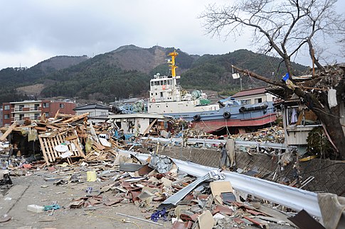 A tug boat among the debris in Ofunato.