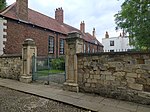 Wall, gates and gate piers approximately 90 metres south-west of Number 1