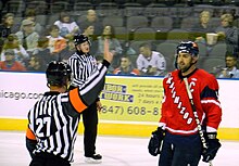 O'Neill speaking with a referee following a penalty while with the K-Wings Wes O'Neill with referee.JPG
