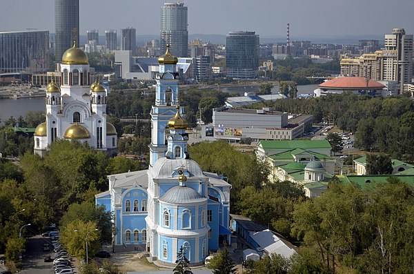 The Church of All Saints in 2016 (top left), where the Ipatiev House used to be. Voznesensky Cathedral is in the foreground, where a machine gun was m