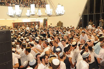 Simchat Beit HaShoeivah at Mercaz HaRav. The participants are dressed as typical for Shabbat.