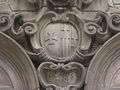 Escudo del hospital, en la fachada de la capilla, esculpido por Pere Costa
