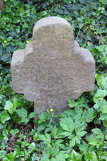 Grave cross at the well