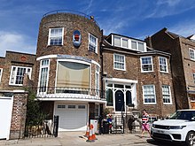The first-floor drawing room of the 1920s "Galleon Wing" extension to Said House, with its large curved plate-glass window, was the "home" of the first series of the BBC's The Apprentice in 2005. 20210602 112154 Said House, Chiswick Mall.jpg