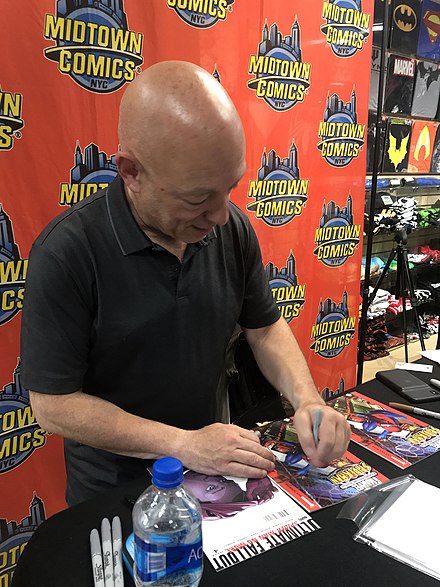Miles' co-creator, writer Brian Michael Bendis, signing copies of Ultimate Spider-Man and Ultimate Fallout #4, in which Miles Morales first appeared, at Midtown Comics in Manhattan