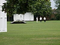 Abbey Rumput lapangan kriket setelah rain.jpg