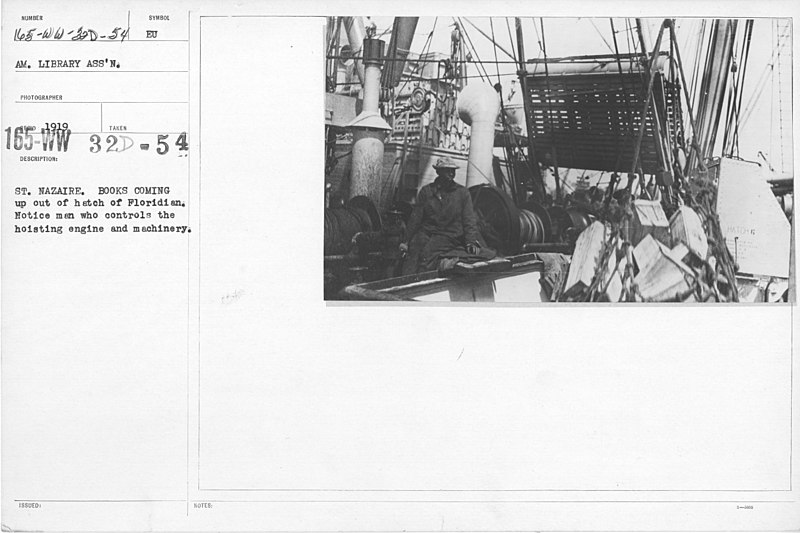 File:American Library Association - ALA - European - French - St. Nazaire. Books coming out of hatch of Floridian. Notice man who control the hoisting engine and machinery - NARA - 20801618.jpg