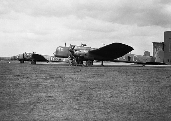 Armstrong Whitworth Whitley Mk Vs of No. 102 Squadron RAF being prepared for a leaflet-dropping sortie at Driffield, Yorkshire, 7 March 1940