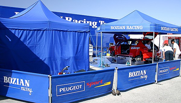 Bozian Racing and Daniel Carlsson's Peugeot 206 WRC at the 2005 Cyprus Rally.