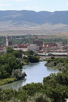 Overview of downtown Casper, looking south toward Casper Mountain, with North Platte River in foreground.