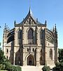 Facade of St. Barbara's church in gothic style with prominent flying buttresses