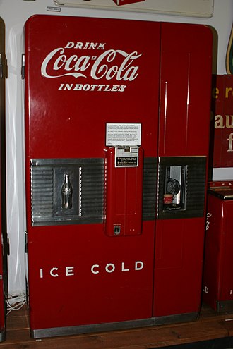 The 1948 Coca-Cola "Vendo Decapper" used 17 steps to dispense bottle, remove cap and pour into cup, eliminating the need for customers to dispose of bottles. Coca-Cola Vendo Decapper.jpg