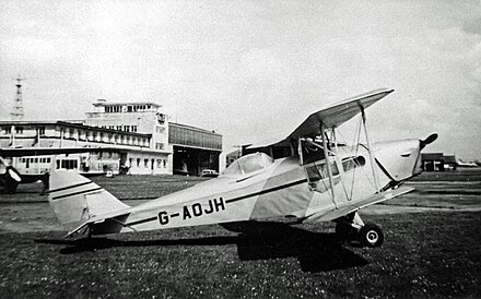Canadian-built DH.83C Fox Moth with canopy fitted to pilot's position at Manchester (Ringway) Airport in 1955