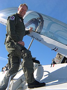 Dan Clark in a flight suit on a jet fighter.jpg