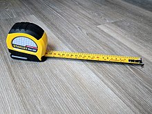 A dual scale inch/centimeter tape measure. Dual Scale Stanley Tape Measure.jpg