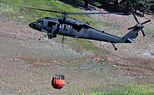 A Nevada Army National Guard UH-60 Blackhawk helicopter operates during a firefighting training in northern California in 2015. Flight 1.jpg