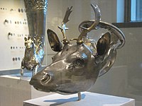 The Stag’s Head Rhyton dating to 400BCE, the largest so far known of recent examples, recently surrendered and worth $3.5 million, originally rediscovered in the 20th century after rampant looting in Milas, Turkey[14][15][16]