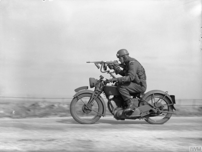 File:Guardsman riding motorcycle with Tommy gun fitted - H 8827.png