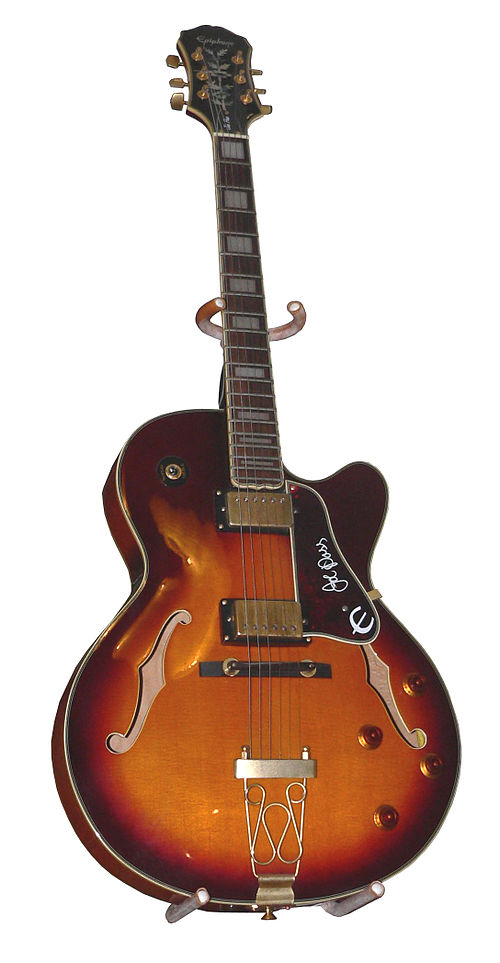 A hollow-bodied Epiphone guitar with violin-style "F" holes.
