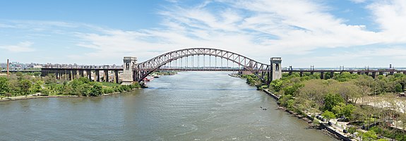 Hell Gate Bridge, which connects Queens, New York City (on the right) and Randall's Island (on the left) over the East River