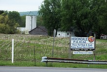 A farm on Columbia County Route 3 in Ancram, New York. Herondale Farm sign, Ancram, New York.jpg