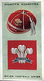 Cigarette card from 1924, containing the emblem as used by the Welsh Football Union (the WRU's former name). Hignett 24.welsh football union.jpg