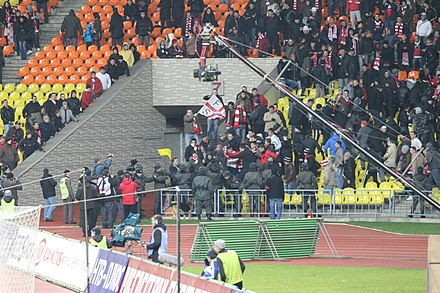 Football hooligans fighting police officers in a football match, Moscow.