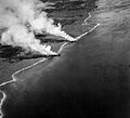 Japanese transports Hirokawa Maru and Kinugawa Maru beached and burning on Guadalcanal, 15 November 1942 (80-G-67248).jpg