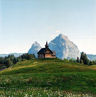 View of the Kapelle Maria Hilf in Stoos, Switzerland, with Grosser Mythen and Kleiner Mythen in the distance.