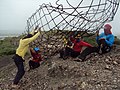 The team preparing to install the armature of the statue's face