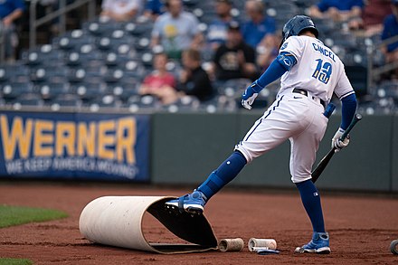 Gabriel Cancel of the Omaha Storm Chasers unfurls the on-deck circle during a game at Werner Park in 2022