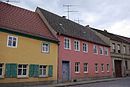 Residential house with walled-in cannon balls in the gable