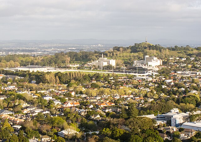 Maungakiekie / One Tree Hill, Cornwall Park, Alexandra Park and Greenlane Clinical Centre and suburban Epsom houses seen from Maungawhau / Mount Eden