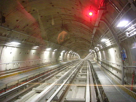 Inside a tunnel on the Turin Metro, the interlocking tunnel lining segments placed by a tunnel boring machine can be clearly seen.