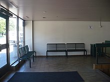 A waiting area is located inside the entrance to South Common Centre. MiWay South Common waiting.JPG