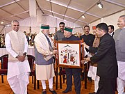 Narendra Modi being welcomed by the Governor of Himachal Pradesh, Shri Acharya Devvrat and the Chief Minister of Himachal Pradesh, Shri Virbhadra Singh, at a function, in Mandi, Himachal Pradesh October 18, 2016