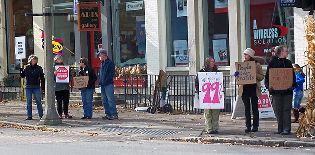 Occupy protesters with "We are the 99%" signs in Bennington, Vermont