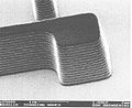 SEM image of a photoresist layer used in semiconductor manufacturing taken on a Field emission SEM at 1000 volts, a very low accelerating voltage for an SEM, achievable in Field Emission SEMs.