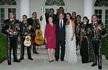 George and Laura Bush at the White House with Mariachi Campanas de America. President George W. Bush and Laura Bush pose for photos with singer Shaila Durcal, Dorio Ferreira Sanchez and the Mariachi Campanas de America.jpg