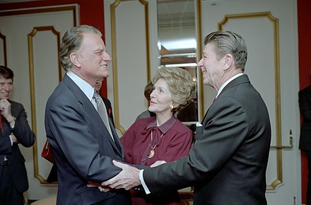 President Ronald Reagan and first lady Nancy Reagan greet Graham at the National Prayer Breakfast of 1981