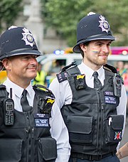 A London police officer (right) with rainbow colors on his cheek at Pride London in 2019 Pride London 39.jpg