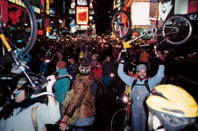 Critical Mass, Time's Square, last Friday of every Month thousands of bicyclists lifted their bikes to demand Time's square become Auto Free: group bike rides helped increase cycling and put pressure on the city for sustainable infrastructure. Raise the Bike.png