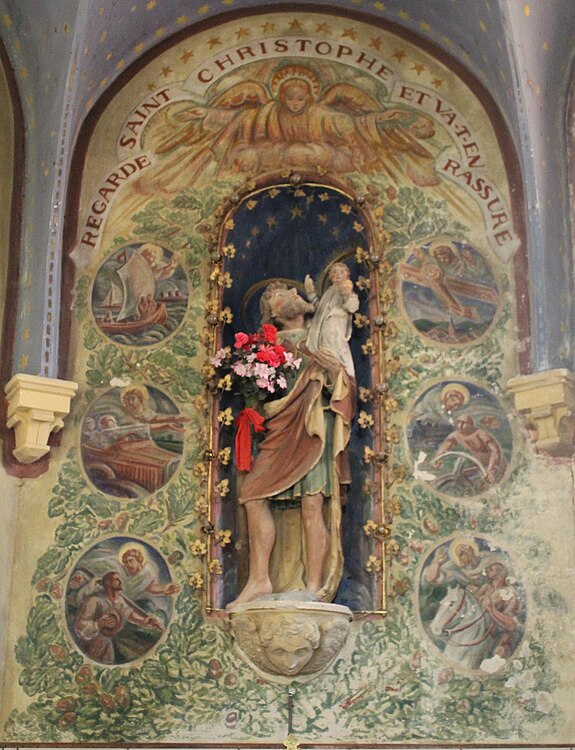 Statue de saint Christophe entourée de médaillons avec les différents moyens de transport, réalisés par Duilio Donzelli.