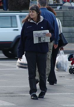 A street newspaper vendor, selling Street Sheet, in San Francisco Street-sheet-saleswoman-crop.jpg