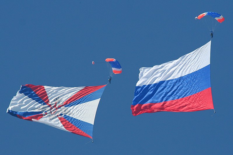 File:The Flag of Russia and the Ministry of Defence flag arrive to open the flying display at the Russian Air Force 100th Anniversary Airshow.jpg