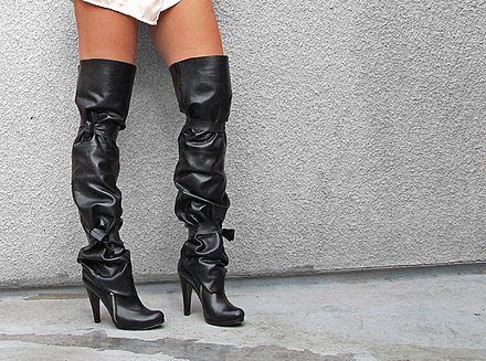 Leather thigh high boots being worn