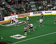 The New York Titans defend against the Calgary Roughnecks during the 2009 NLL Championship game, in Calgary. Titans at Roughnecks.JPG